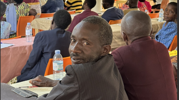 Man looking at camera in a group of people